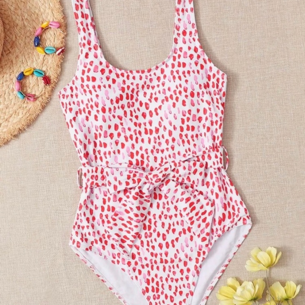 Woman’s dressy red and pink dotted bathing suit with bow